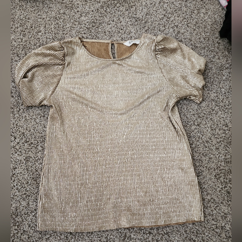 Beautiful girls gold top with puff sleeves.